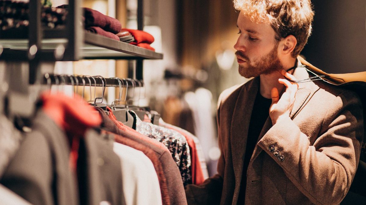 young-handsome-man-choosing-cloth-shop-1-1-scaled.jpg